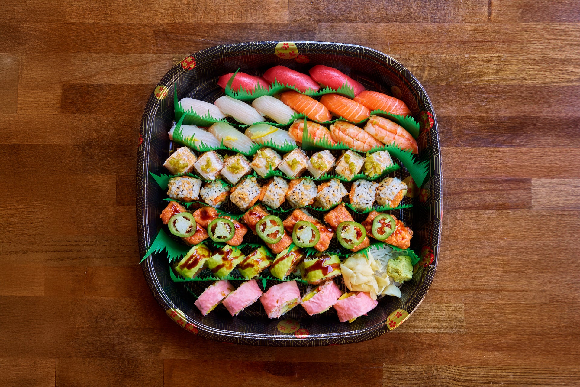 Assorted sushi on a wooden surface
